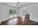 Elegant dining area with hardwood floors, modern chandelier, and bright, airy feel at 263 Fairway Cir, Rock Hill, SC 29730