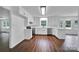 Spacious kitchen with stainless steel appliances, white cabinets, and wood-look floors at 263 Fairway Cir, Rock Hill, SC 29730