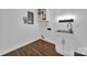 Practical laundry area with sink, built-in shelves, and wood-style flooring at 263 Fairway Cir, Rock Hill, SC 29730