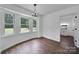 Bright laundry room featuring a wash sink, white cabinets, and hardwood floors at 263 Fairway Cir, Rock Hill, SC 29730
