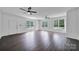 Bright living room with modern ceiling fans, beautiful wood flooring, and natural light at 263 Fairway Cir, Rock Hill, SC 29730