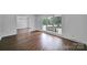 Sunlit living room featuring hardwood floors, large windows, and an inviting space at 263 Fairway Cir, Rock Hill, SC 29730