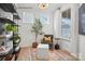 Beautiful flex room with hardwood floors, natural light, black shelving and decor at 2658 Headwind Ct # 245, Belmont, NC 28012