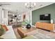 Spacious living room area with a large sofa, hardwood floors, and windows with natural light at 2658 Headwind Ct # 245, Belmont, NC 28012