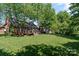 Expansive backyard featuring a well-maintained lawn and a spacious deck, perfect for outdoor entertaining at 3124 17Th Street Ne Ln, Hickory, NC 28601