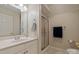 Clean bathroom featuring a shower, vanity with sink, and neutral decor at 3124 17Th Street Ne Ln, Hickory, NC 28601