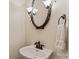 Powder room featuring elegant fixtures including an ornate mirror and lighting at 3124 17Th Street Ne Ln, Hickory, NC 28601