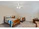Cozy bedroom features two twin beds, a ceiling fan, and neutral paint at 3124 17Th Street Ne Ln, Hickory, NC 28601