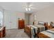 Spacious bedroom with neutral wall paint, a ceiling fan and a large closet at 3124 17Th Street Ne Ln, Hickory, NC 28601