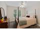Comfortable bedroom offers a queen-sized bed, a dresser, and a window view at 3124 17Th Street Ne Ln, Hickory, NC 28601