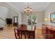 Elegant dining room featuring hardwood floors, large window, and stylish lighting fixture at 3124 17Th Street Ne Ln, Hickory, NC 28601