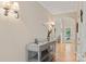 View of the home's entryway with hardwood floors, arched doorway, and stylish console table at 3124 17Th Street Ne Ln, Hickory, NC 28601