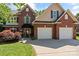 Traditional brick home featuring a well-manicured lawn and a convenient two-car garage at 3124 17Th Street Ne Ln, Hickory, NC 28601