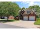 Charming home with brick facade, two-car garage, and a lush green lawn at 3124 17Th Street Ne Ln, Hickory, NC 28601
