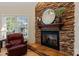 Living room featuring stone fireplace and comfortable leather chair at 3124 17Th Street Ne Ln, Hickory, NC 28601