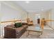 Comfortable upstairs living area with cozy seating, staircase, and natural light at 3124 17Th Street Ne Ln, Hickory, NC 28601