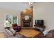 Living room with stone fireplace, hardwood floors, and comfortable seating at 3124 17Th Street Ne Ln, Hickory, NC 28601