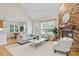 Bright living room with fireplace, wood floors and an open floor plan at 3124 17Th Street Ne Ln, Hickory, NC 28601