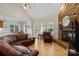 Inviting living room features vaulted ceilings, a stone fireplace, and hardwood floors at 3124 17Th Street Ne Ln, Hickory, NC 28601