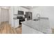 Modern kitchen features granite countertops, stainless steel appliances and white cabinetry at 314 Adams St, Salisbury, NC 28144