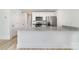 Kitchen island features granite counters, stainless steel appliances and white cabinetry at 314 Adams St, Salisbury, NC 28144