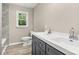 Updated bathroom featuring modern dual sink vanity with a sleek design and bright window view at 316 Fulton St, Kings Mountain, NC 28086