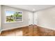 Bright bedroom with hardwood floors, fresh paint and large window overlooking the front yard at 316 Fulton St, Kings Mountain, NC 28086