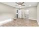 Spacious main bedroom featuring wood-look floors, neutral walls, ceiling fan, and ensuite bathroom access at 316 Fulton St, Kings Mountain, NC 28086
