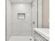 Modern shower with marble-style tile and built-in niche at 316 Fulton St, Kings Mountain, NC 28086