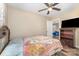 Cozy bedroom with a ceiling fan and a glimpse into an adjoining room at 319 Leonard Ave, Albemarle, NC 28001