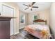 Inviting bedroom with wood-look floors, natural light, and a comfortable atmosphere at 319 Leonard Ave, Albemarle, NC 28001