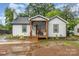 Charming renovated home features a cozy front porch and a freshly painted exterior at 319 Leonard Ave, Albemarle, NC 28001