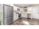 Bright kitchen with stainless steel appliances, sleek countertops, and modern white cabinetry at 319 Leonard Ave, Albemarle, NC 28001