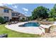 Beautiful backyard featuring a pool, patio, and manicured landscaping at 324 Squash Harvest Ct, Matthews, NC 28104