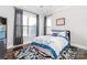Cozy bedroom with natural light, large windows, and a comfortable bed at 324 Squash Harvest Ct, Matthews, NC 28104