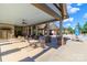 Inviting poolside seating area under a covered patio, perfect for relaxing and socializing near the community pool at 324 Squash Harvest Ct, Matthews, NC 28104