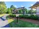 Scenic walking trail with a pergola and lush landscaping, adjacent to the community pool in Atherton at 324 Squash Harvest Ct, Matthews, NC 28104