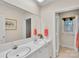 Bright bathroom featuring a double sink vanity and lots of storage with a tub/shower combo at 331 Glen Oaks Rd, Charlotte, NC 28270