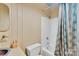 Cozy full bathroom with a shower and tub combo, vanity and colorful shower curtain at 331 Glen Oaks Rd, Charlotte, NC 28270
