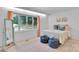Bright bedroom featuring a large window and seating area with a queen size bed at 331 Glen Oaks Rd, Charlotte, NC 28270