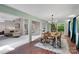 Bright dining room with brick floors adjacent to living area at 331 Glen Oaks Rd, Charlotte, NC 28270