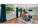 Sunlit dining room featuring large windows and outdoor views at 331 Glen Oaks Rd, Charlotte, NC 28270
