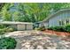 Exterior of home with lush landscaping, garage, and long driveway at 331 Glen Oaks Rd, Charlotte, NC 28270
