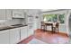 Bright kitchen nook with white appliances and sunny window views at 331 Glen Oaks Rd, Charlotte, NC 28270