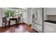 Bright breakfast nook with large window, stainless steel refrigerator, and brick floors at 331 Glen Oaks Rd, Charlotte, NC 28270