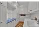 Bright laundry room with ample cabinet space, blue countertops, and a sink at 331 Glen Oaks Rd, Charlotte, NC 28270