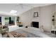 Bright living room featuring white brick fireplace and skylight, with access to the backyard at 331 Glen Oaks Rd, Charlotte, NC 28270