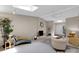 Bright living room with a brick fireplace, sky lights, and neutral decor at 331 Glen Oaks Rd, Charlotte, NC 28270