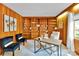 Charming office space featuring wood paneled walls, custom built-in shelving, and natural light at 331 Glen Oaks Rd, Charlotte, NC 28270