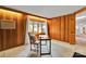 Office space featuring wood paneled walls, a neutral rug, and ample natural light at 331 Glen Oaks Rd, Charlotte, NC 28270